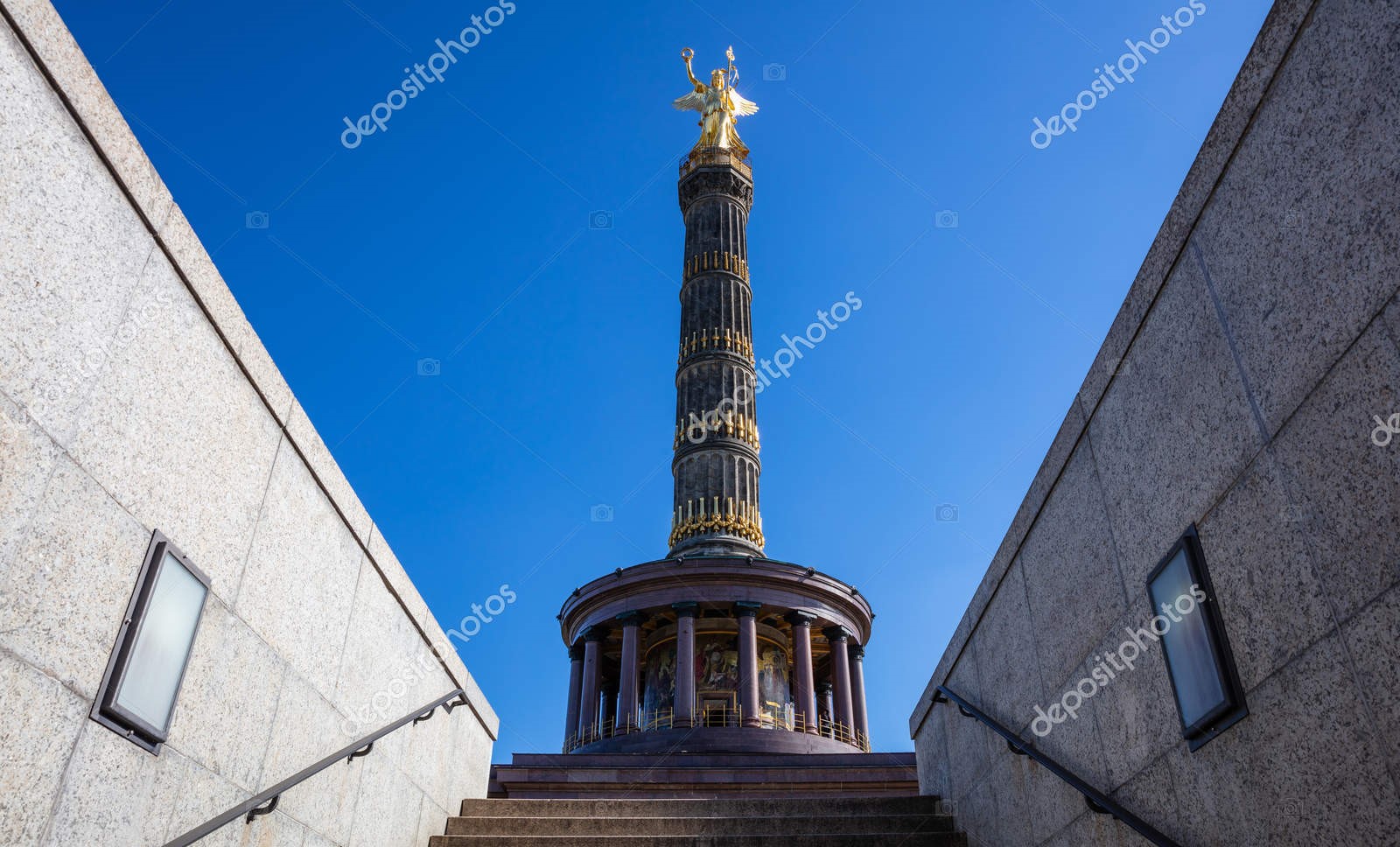 Mountain massif, sunbathed, partly covered in show.