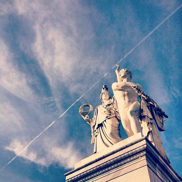 Mountain massif, sunbathed, partly covered in show.